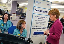 Sturgeon visits an NHS24 call centre in the wake of rising COVID-19 cases, March 2020 NHS24 thanks (49621480001).jpg