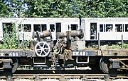 A pair of 4xx-series 'RW' bolster wagons at Neasden, with some derelict A Stock behind.