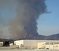 A backfire, lit in the foothills of Rancho Santa Margarita, as viewed from an office window