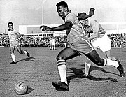 Pelé dribbling past a defender during Malmö-Brazil 1-7 (Pelé scored 2 goals) at Malmö city stadium. (8 May 1960)