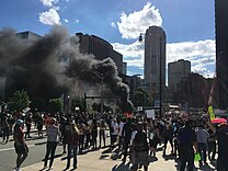 Rioters burning a police car in Pittsburgh on May 30