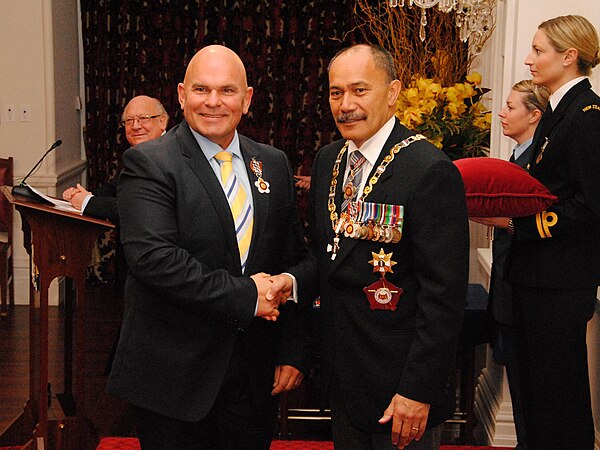 Hide (left), after his investiture as a Companion of the Queen's Service Order by the governor-general, Sir Jerry Mateparae, at Government House, Well