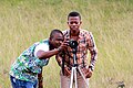 Some participants setting up a camera for a group photo.