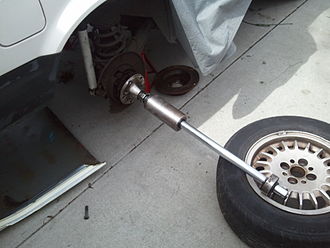A slide hammer attached to the inside of a rear wheel bearing Slide hammer boomstick.jpg