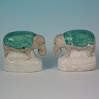 Small staffordshire pottery figures of elephants 2.4ins tall, circa 1860.