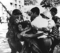 South Vietnamese paratroopers drag demonstrators away.jpg