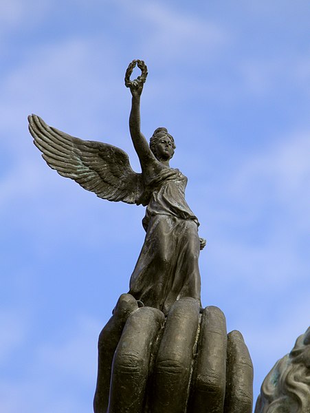 File:Statue of Alexander the Great riding Bucephalus and carrying a winged statue of Nike (square of Alexander the Great) in Pella city, detail of Nike (7060890627).jpg