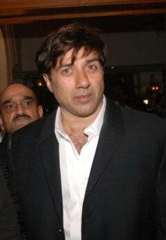 Deol attending the release of Dev Anand's autobiography Romancing with Life in 2007.