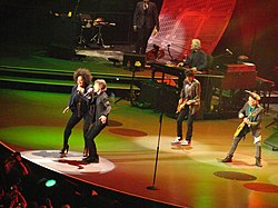 Fischer singing with Jagger and The Rolling Stones during their Fifty and Counting Tour, in Boston Mass., June 12, 2013