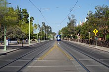 2nd Street with a Sun Link streetcar in the background