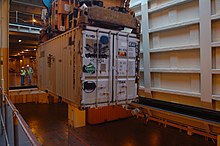 Loading a container (with the Hazmat Class 2 symbol on the rear doors) aboard a ship. US Army container loading.jpg