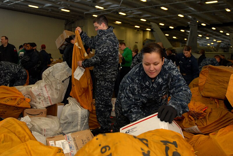 File:US Navy 110324-N-RG360-059 Master at Arms 2nd Class KC Duenas helps sort mail in the hangar bay aboard the aircraft carrier USS Ronald Reagan (CVN.jpg