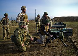 US Navy 111119-N-AC887-002 Secretary of the Navy (SECNAV) the Honorable Ray Mabus fires an AGS-17, Russian 30mm automatic grenade launcher at the K.jpg