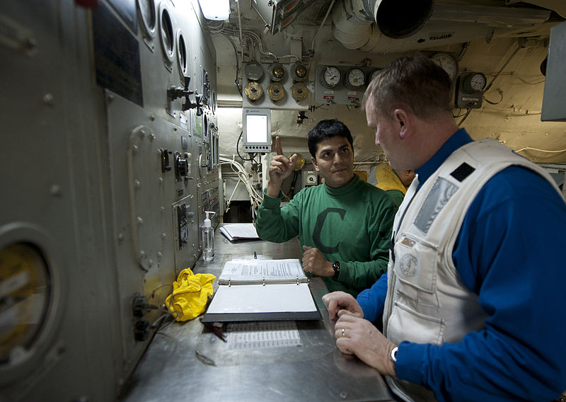 File:US Navy 120130-N-DR144-692 A Sailor discusses catapult operations with Rear Adm. Thomas K. Shannon, commander of Carrier Strike Group (CSG) 1, in t.jpg