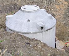 A concrete under-floor cistern being installed. Unterirdische Zisterne.jpg