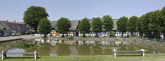 The street named ""Ved kæret" and the pond in Nordby, Samsø, Denmark.