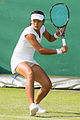 Wang Yafan competing in the first round of the 2015 Wimbledon Qualifying Tournament at the Bank of England Sports Grounds in Roehampton, England. The winners of three rounds of competition qualify for the main draw of Wimbledon the following week.