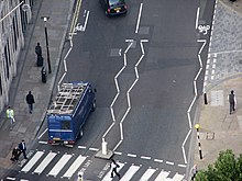 Pedestrian crossing, line markings and street furniture Wavy lines before pedestrian crossing.jpg