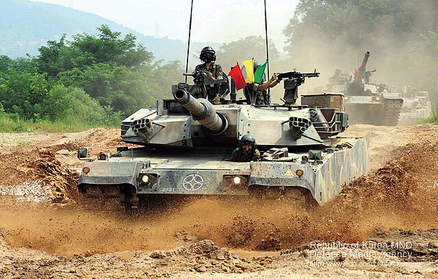 K1A1 tanks of the 20th Mechanized Infantry Division of ROK Army is maneuvering through rough terrain.