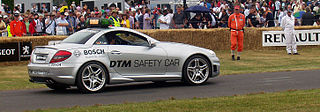 Safety car Car which limits the speed of competing cars on a racetrack