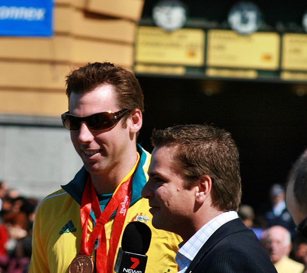Hackett (left) at the Melbourne homecoming parade for 2008 Olympic Team