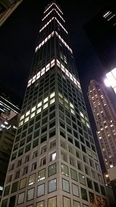 The facade of 432 Park Avenue, illuminated at night