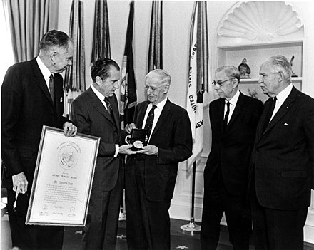 From left to right in a November 1969 photo, Dr. Glenn Seaborg, President Richard Nixon, and the three awardees of the Atomic Pioneers Award: Dr. Vannevar Bush, Dr. James B. Conant, and Gen. Leslie Groves.