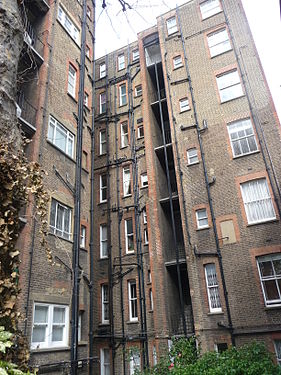 Backside of a London house, with pipes hanging out