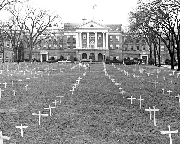 Bascom Hill, 1968, with crosses placed by students protesting the Vietnam War, and sign reading, "Bascom Memorial Cemetery, Class of 1968"