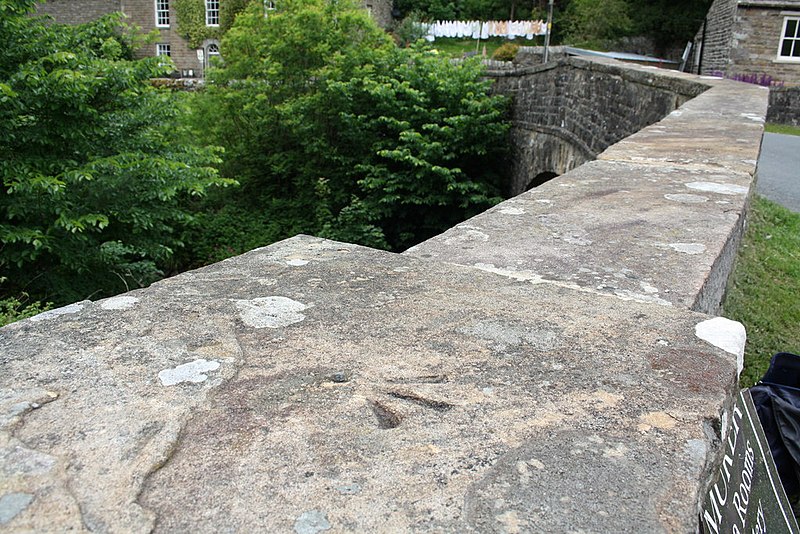 File:Benchmark on top of western parapet of Muker Bridge - geograph.org.uk - 2488435.jpg