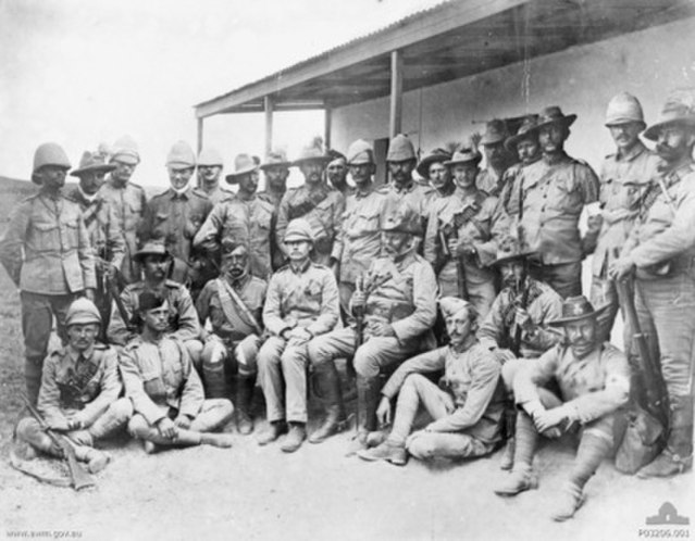 Officers of the Queensland Mounted Infantry. Chauvel is squatting in the front row, second from the right, holding a rifle.