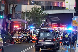 Paramedics outside the shopping centre waiting to treat injured victims Bondi Junction Westfields Stabbing Attack 3.jpg