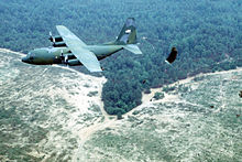 C-130E dropping U.S. Army paratroopers during the Rodeo 92 airdrop competition at Pope Air Force Base, NC in 1992