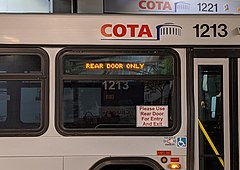 COTA buses notify riders to board using rear doors only COTA rollsign 01.jpg