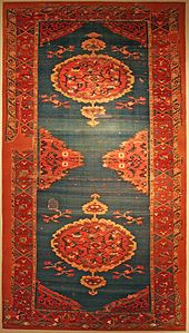 Powerful presence: carpet with double medallion. Central Anatolia (Konya - Karapinar), turn of the 16th/17th centuries. Alaeddin Mosque Carpet with Double Medallion.jpg
