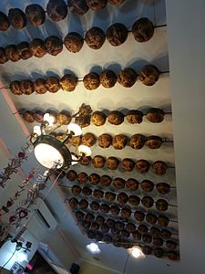 Day 11: The ceiling of a restaurant in Milan, Italy, with bread loaves as ceiling decorations