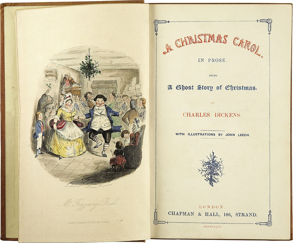 Left-hand page shows Mr and Mrs Fezziwig dancing; the right-hand page shows the words "A Christmas Carol. In Prose. Being a Ghost Story of Christmas by Charles Dickens. With illustrations by John Leech