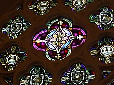 An astrological wheel located in the main stained glass window of a Presbyterian church found in Cambridge, Ontario. The church was finished in 1889. The wheel is not complete, it only contains eight of the twelve signs. Christian Astrological Wheel.JPG