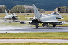 A Typhoon FGR4 in No. 6 Squadron markings taking off from runway 23 at Lossiemouth