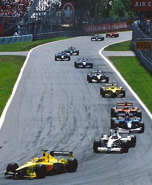 Jarno Trulli leads the midfield on the first lap of the race.