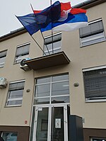 Flags at the Joint Council of Municipalities building.jpg