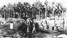 11th Marines cannoneers man a M1918 155 mm howitzer during the Guadalcanal campaign. GuadMarineArtillery2.jpg