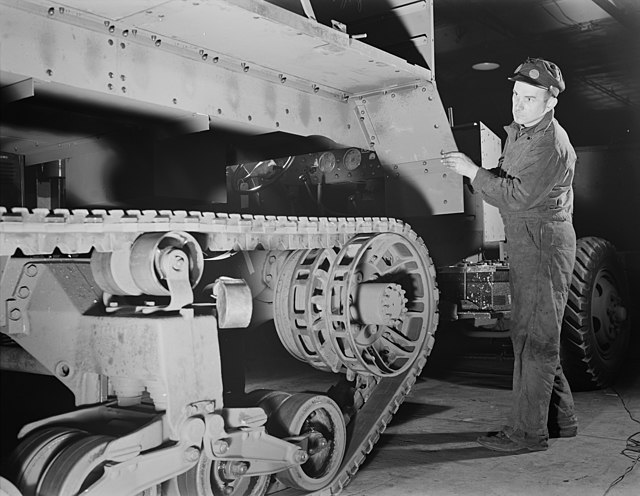 Pictured is the body of a scout car, manufactured by Diebold, being installed at a Diebold plant in Canton, Ohio in 1941.