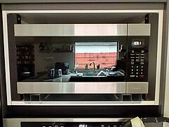 The microwave oven in its position, with the cover frame not installed yet