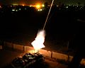 The M1129 being fired at night.