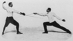 Italo Santelli (bal) és Jean-Baptiste Mimiague (jobb). A fénykép az 1900-as olimpiai játékok alkalmából a Life nevű lapnak készült.[2]