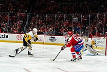 Hagelin (right) being defended by John Marino in 2020. John Marino and Carl Hagelin - 2020 - All-Pro Reels (49479183153).jpg