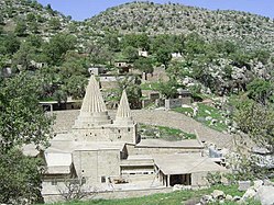 The tomb of Sheikh Adi in Lalish (northern Iraq), the religious center of the Yazidis with holy structures with conical roofs[7]