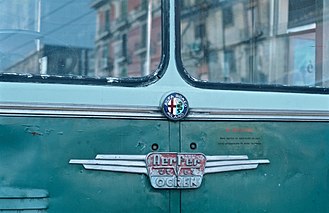 The Alfa Romeo logo and other manufacturers' nameplates on the front of a 1962 model-1000 trolleybus for CTP Napoli Manufacturers nameplates on front of Alfa Romeo-Aerfer-OCREN trolleybus of CTP Napoli.jpg