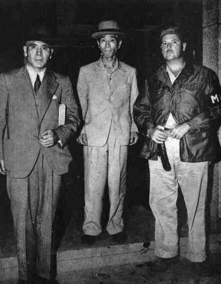 Masaharu Homma (left) and Shigenori Kuroda (center) in U.S. custody